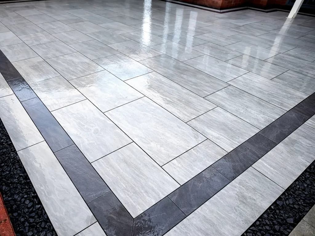 Completed porcelain patio installation by TJE Landscaping & Building Services Ltd