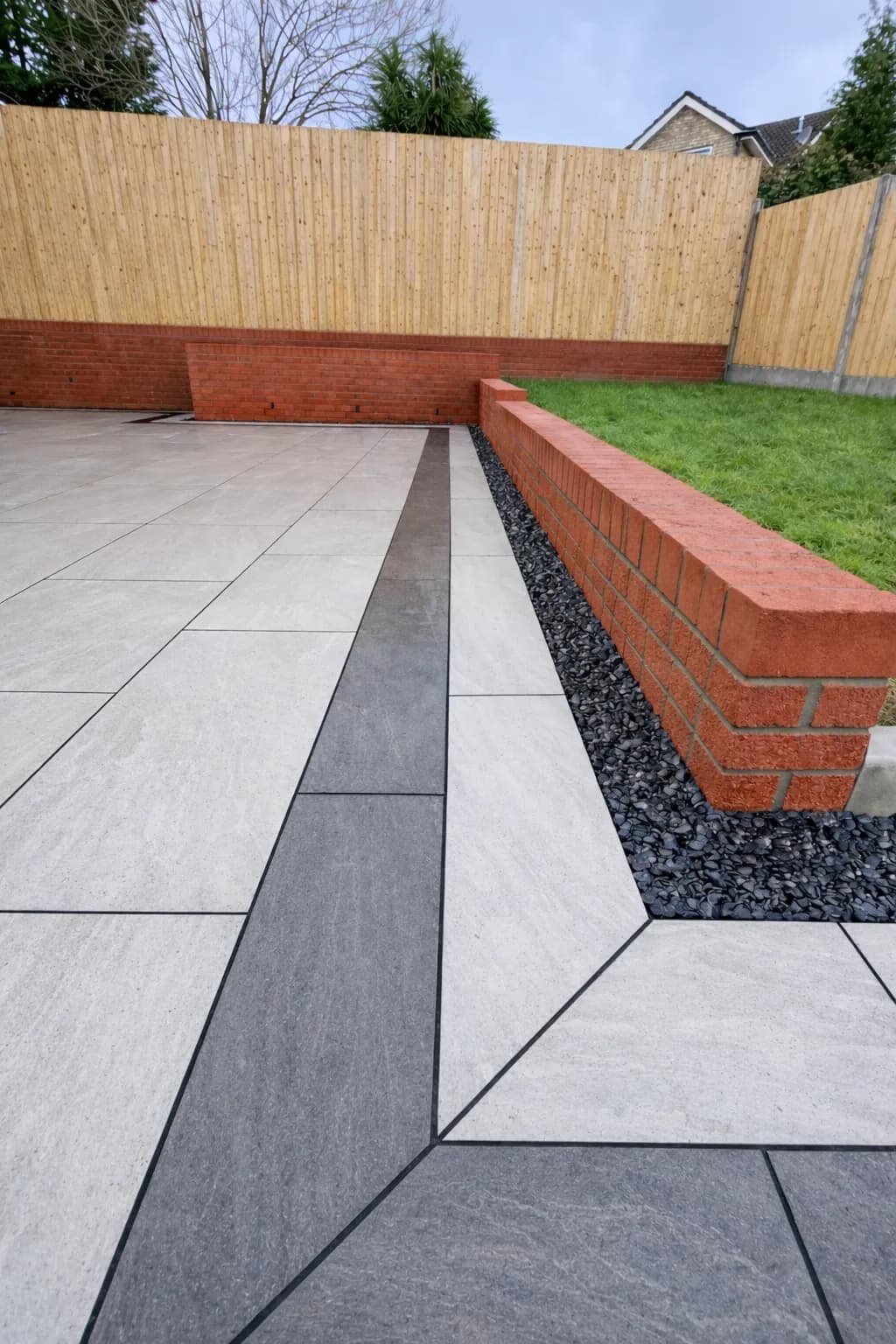 Modern porcelain patio paving with contrasting border in a Pontypool garden