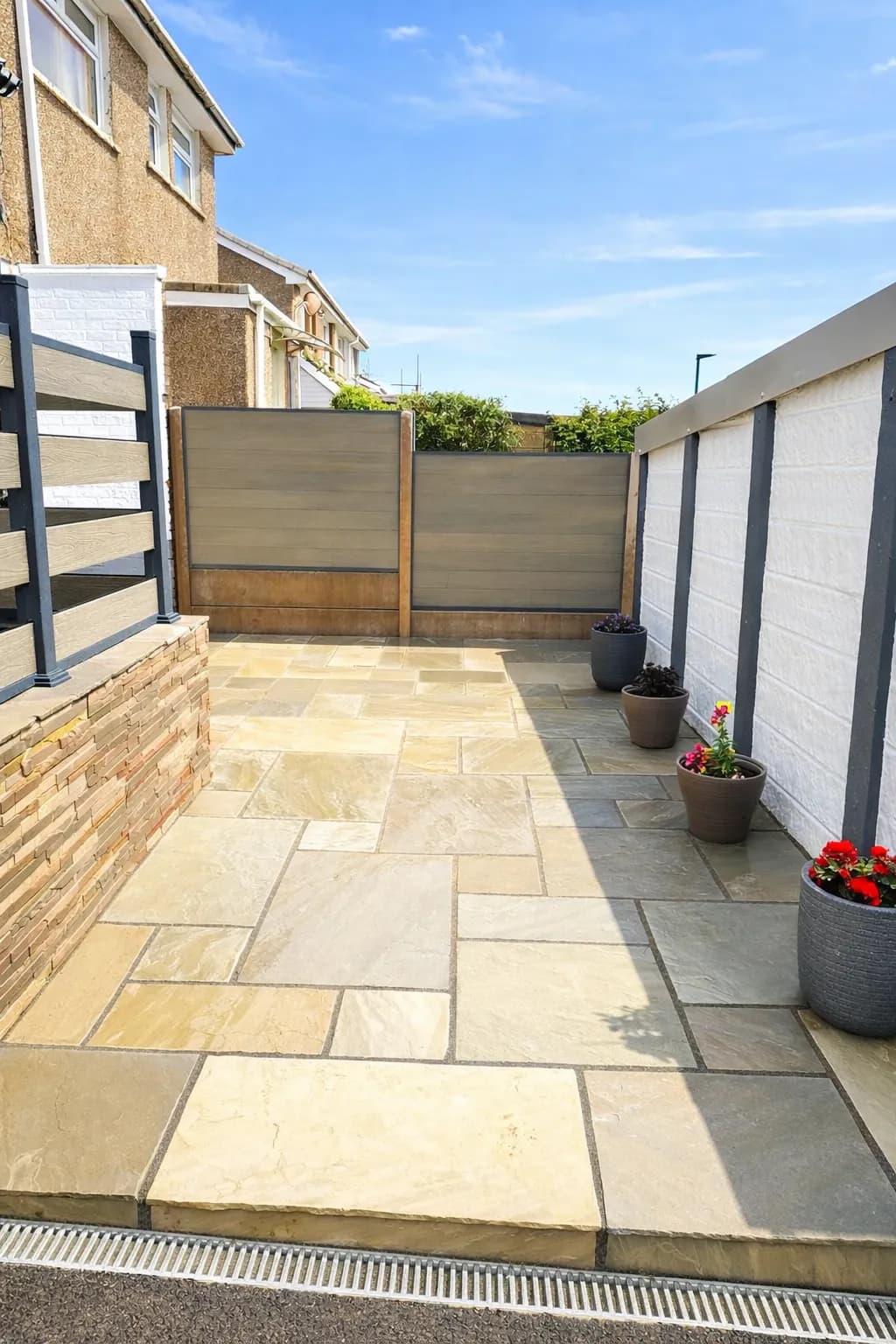 Natural Stone Patio Install With ACO Drain & Composite Fence System