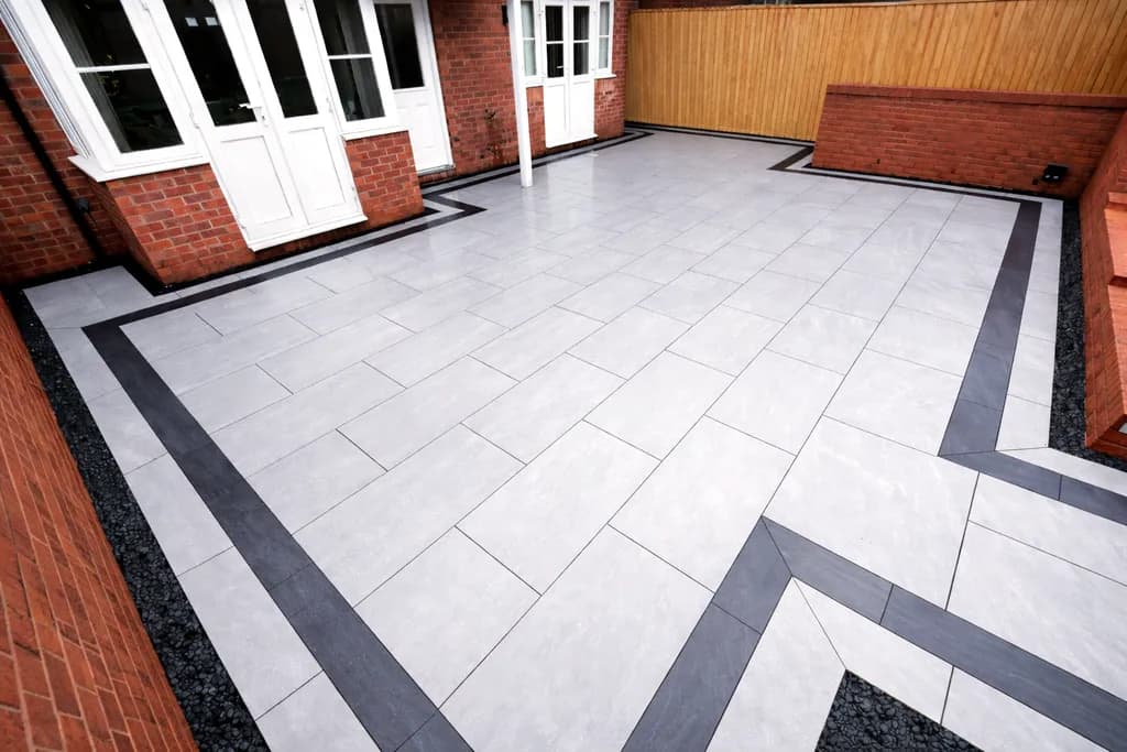 Porcelain patio with picture-frame border installed by TJE Landscaping & Building Services Ltd in South Wales
