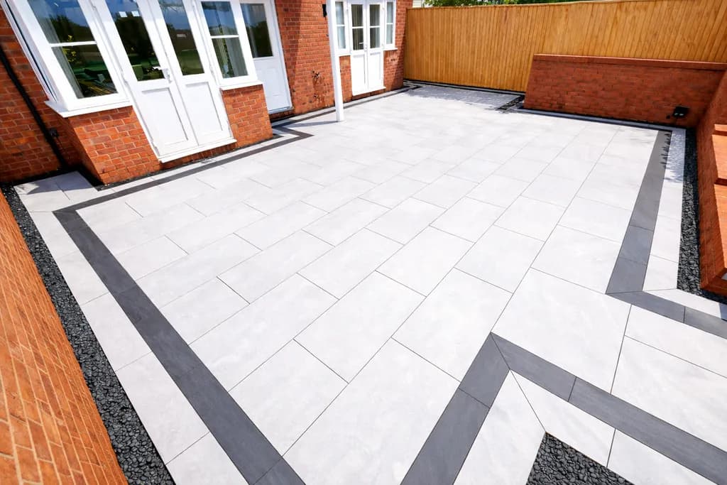 Porcelain patio with picture-frame border installed by TJE Landscaping & Building Services Ltd in South Wales
