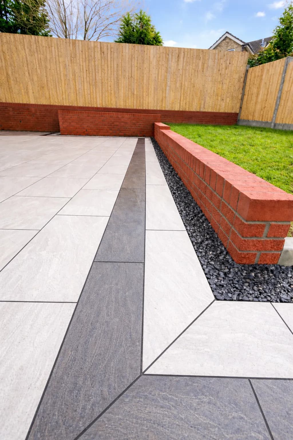 Modern porcelain patio paving with contrasting border in a Pontypool garden