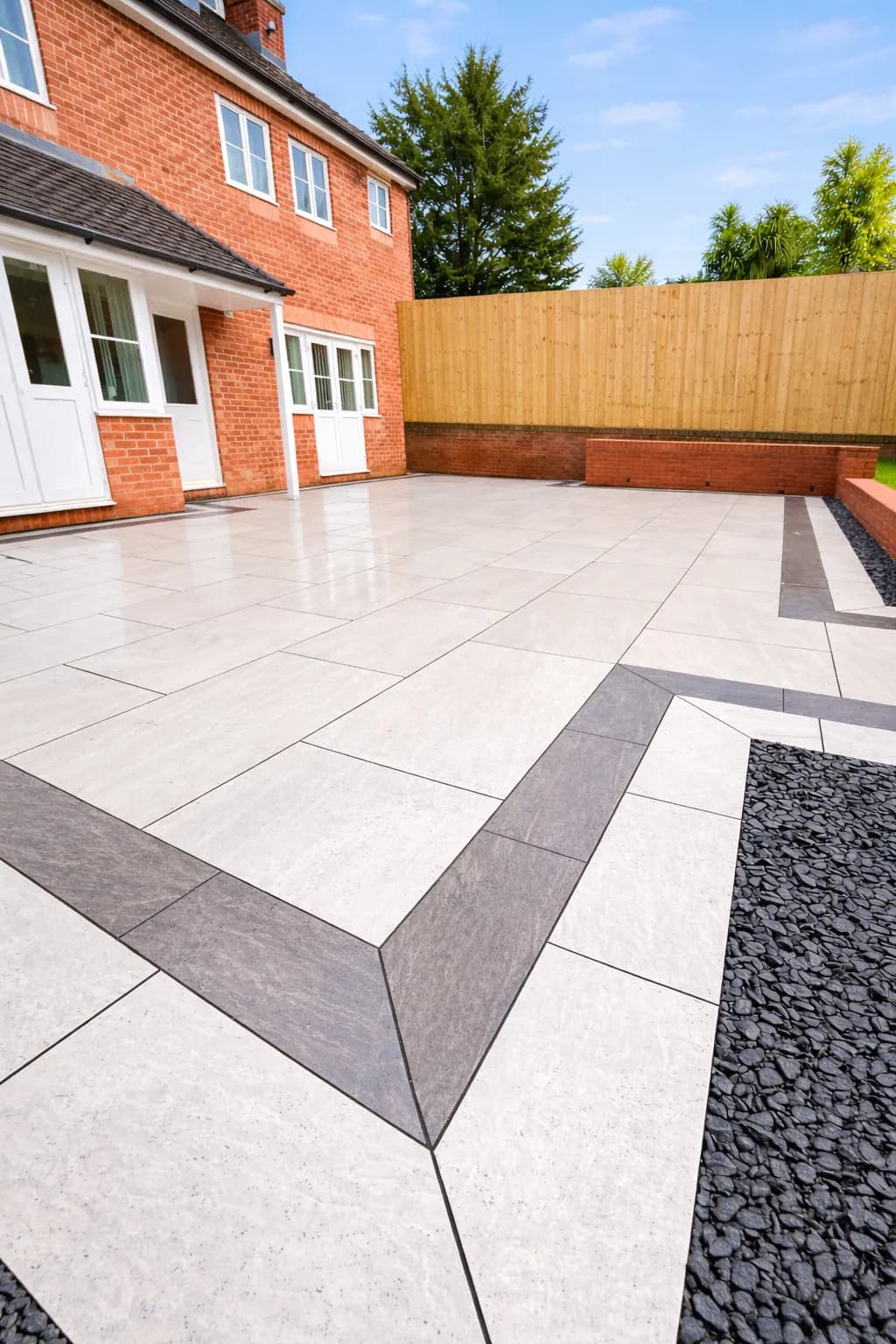 Low-maintenance porcelain patio creating usable outdoor space at a property in Pontypool