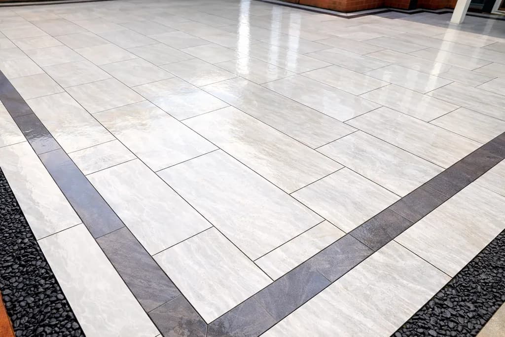 Completed porcelain patio installation by TJE Landscaping & Building Services Ltd