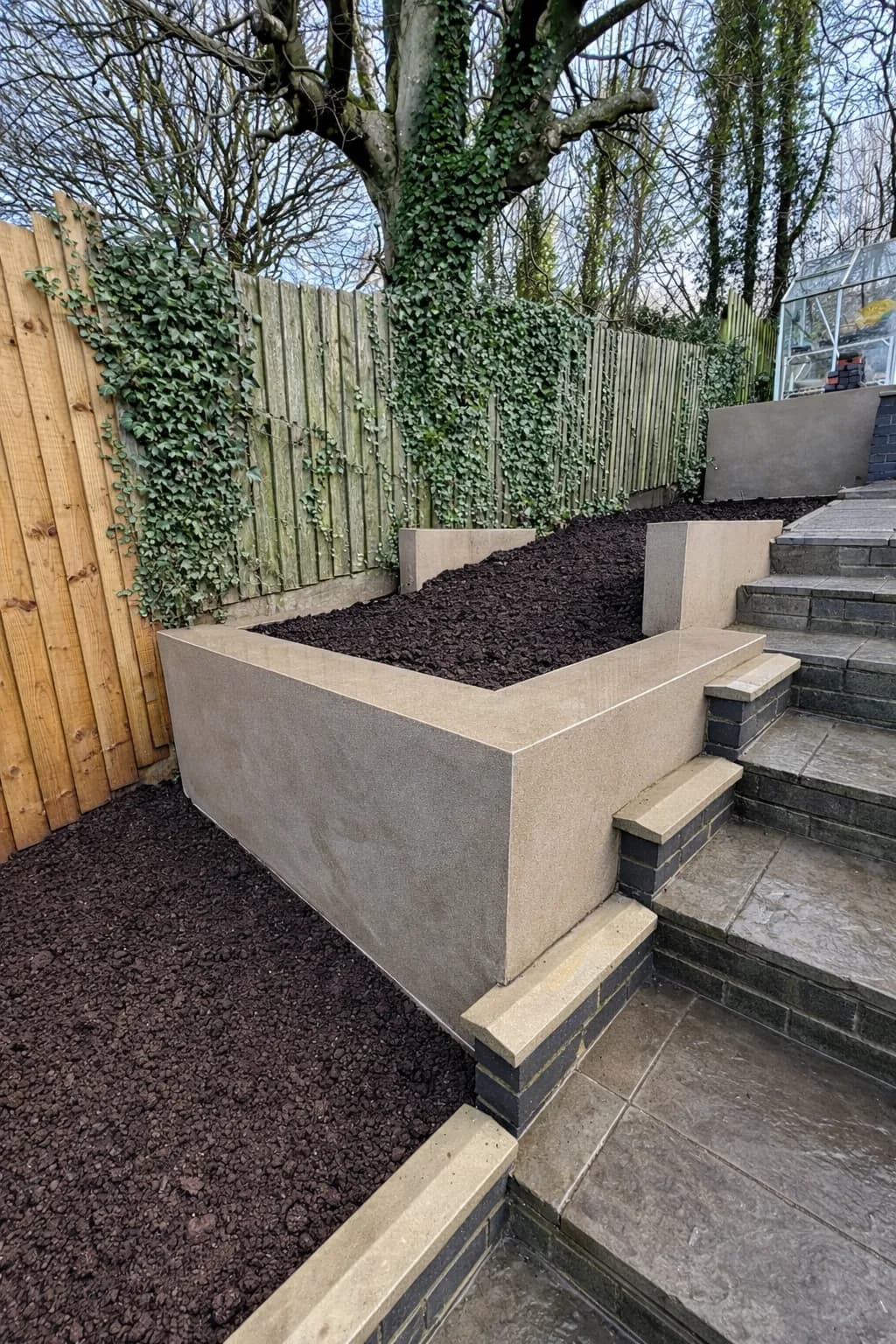 Multi-level garden design featuring rendered block retaining walls for a crisp, contemporary finish.