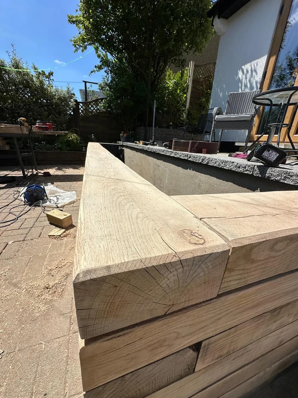 Close-up of solid oak sleeper joints showing sturdy construction and clean timber edges.