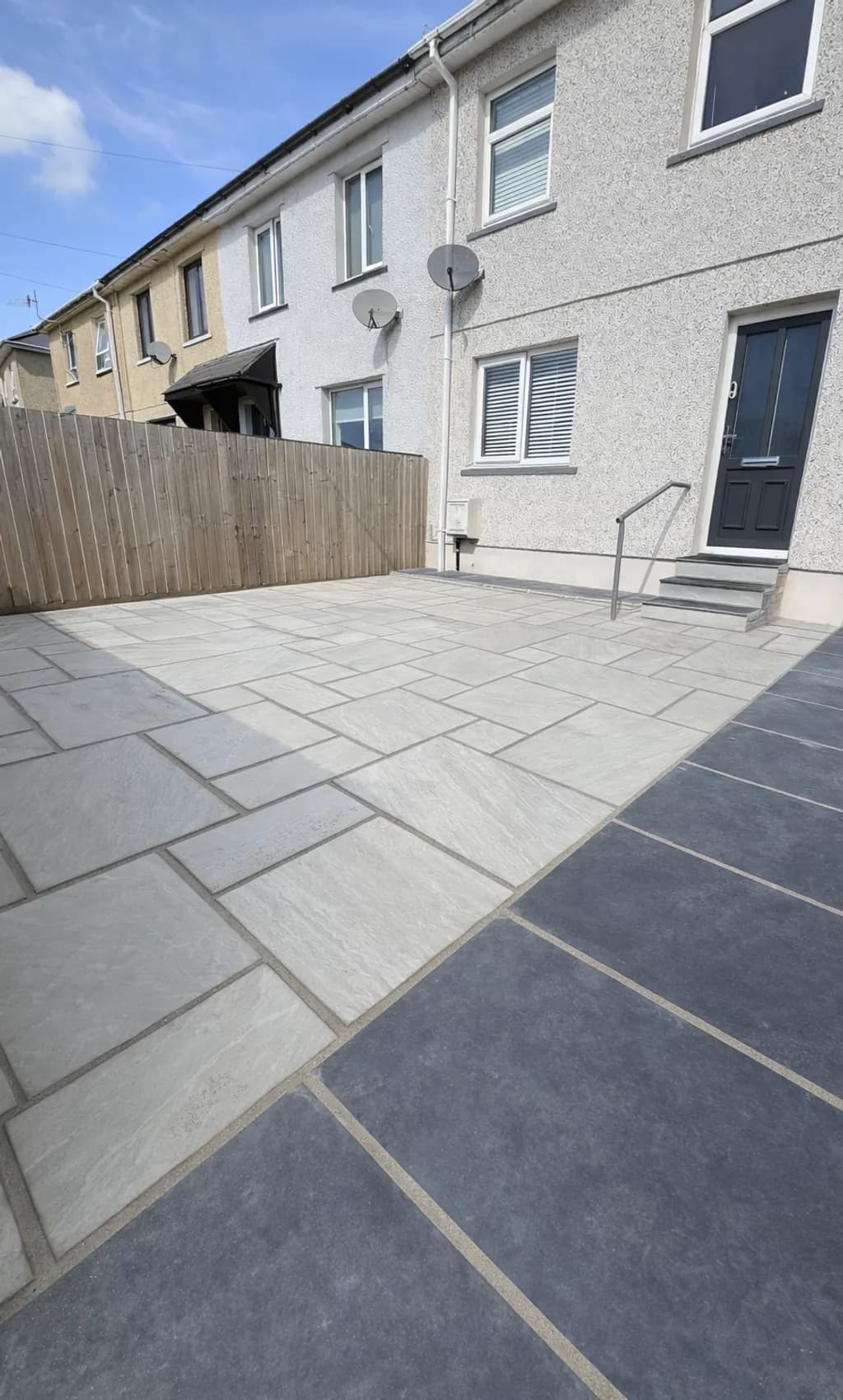 Indian sandstone steps and pathway installed at front and side of house creating a seamless outdoor finish.