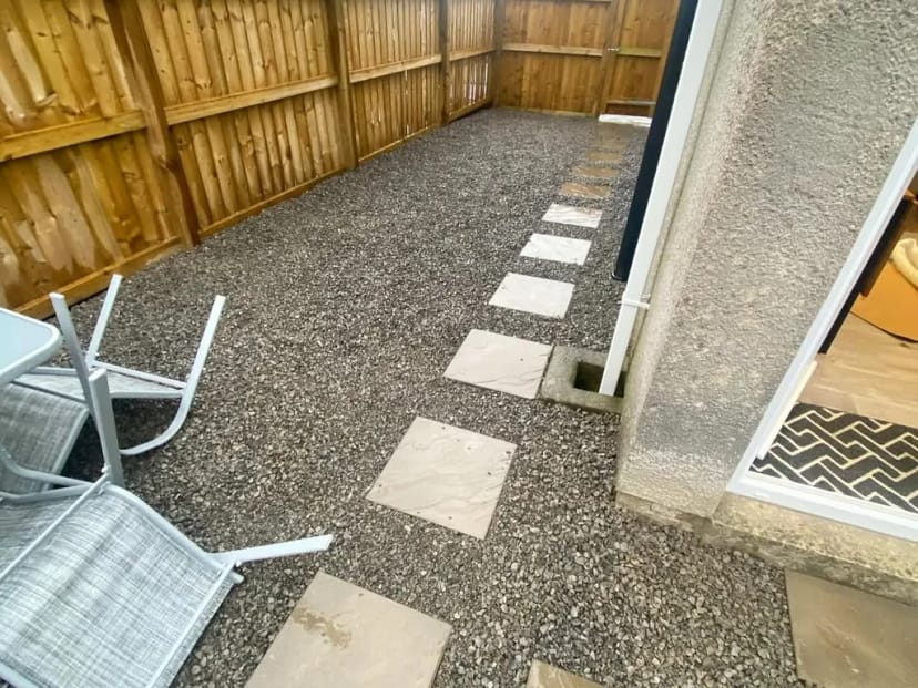 Gravel driveway with paving slab pathway