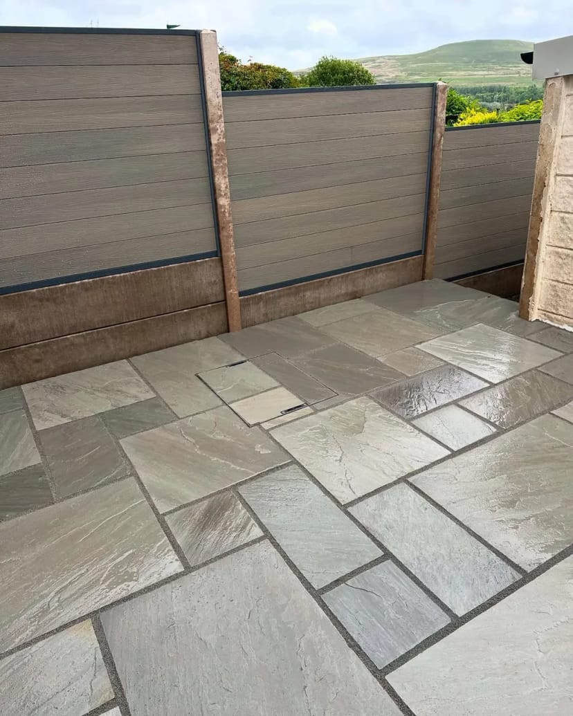 Indian sandstone patio with composite fencing
