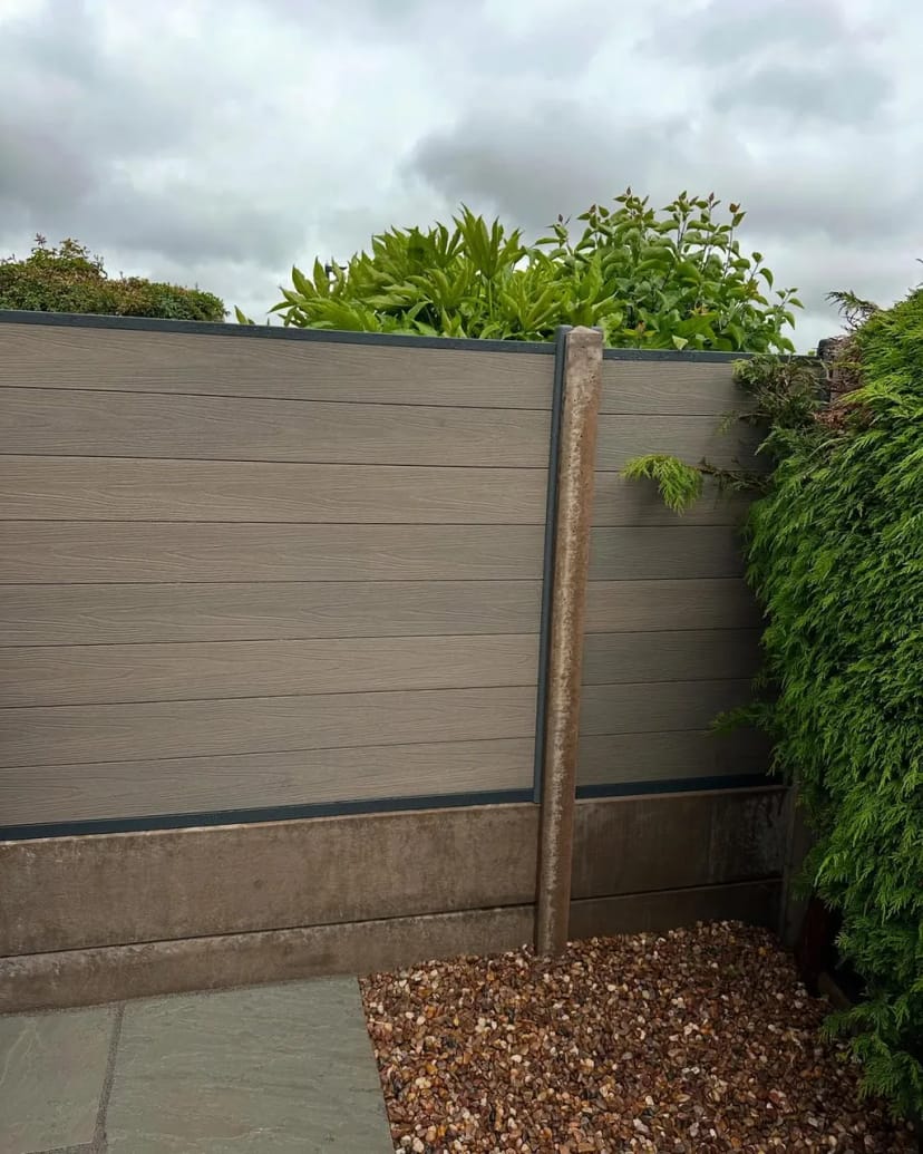 Indian sandstone patio with composite fencing