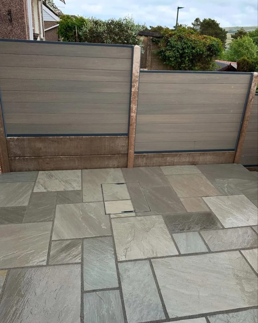 Indian sandstone patio with composite fencing