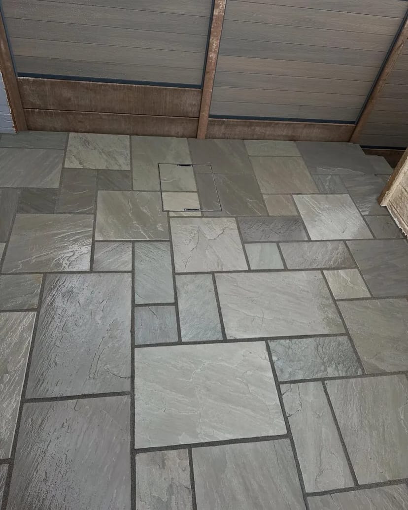 Indian sandstone patio with composite fencing