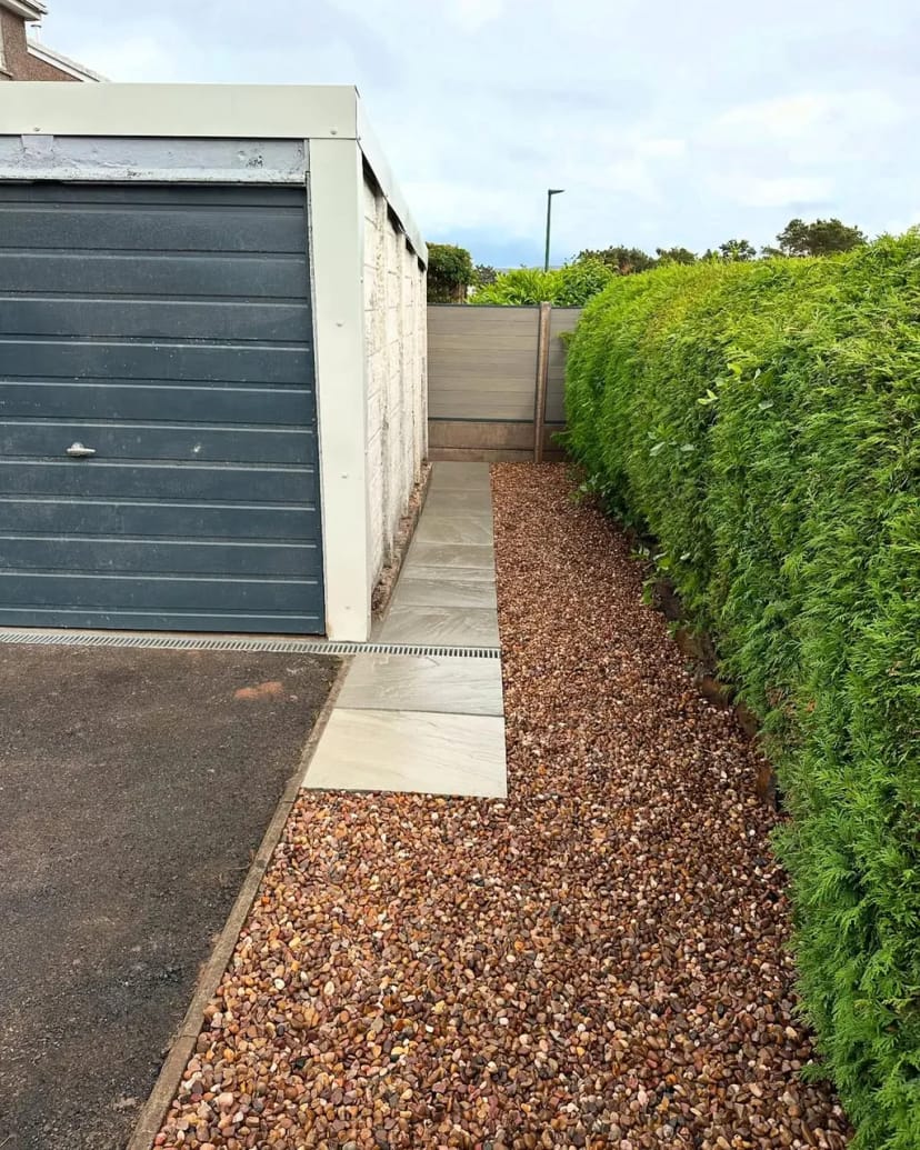 Indian sandstone patio with composite fencing
