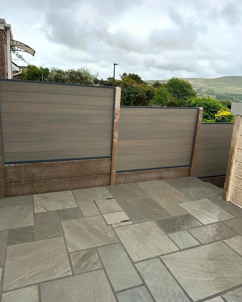 Indian sandstone patio with composite fencing