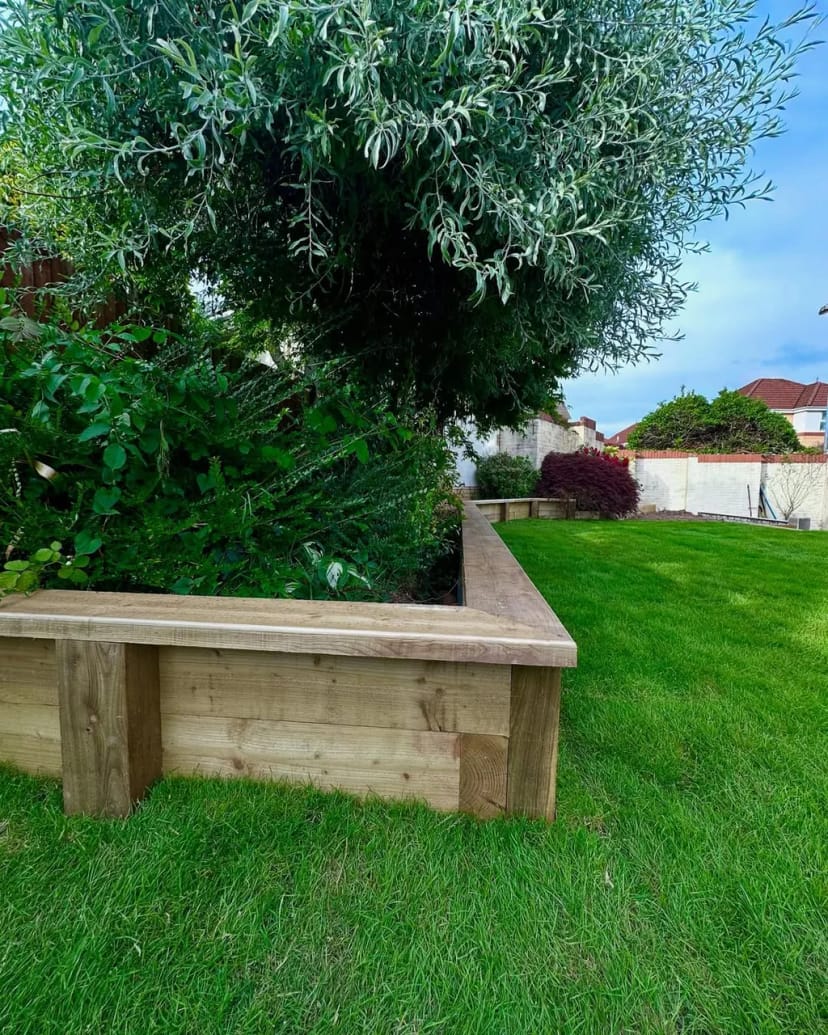 Full garden renovation - levelling, sleeper beds, fresh turf, porcelain copings and new steps