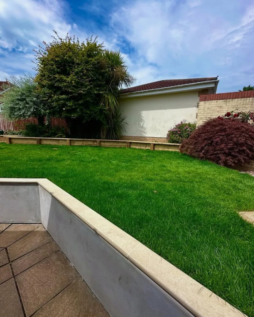 Full garden renovation - levelling, sleeper beds, fresh turf, porcelain copings and new steps