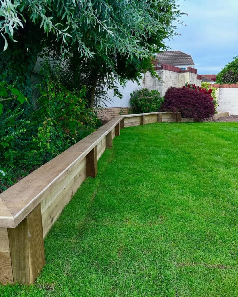 Full garden renovation - levelling, sleeper beds, fresh turf, porcelain copings and new steps