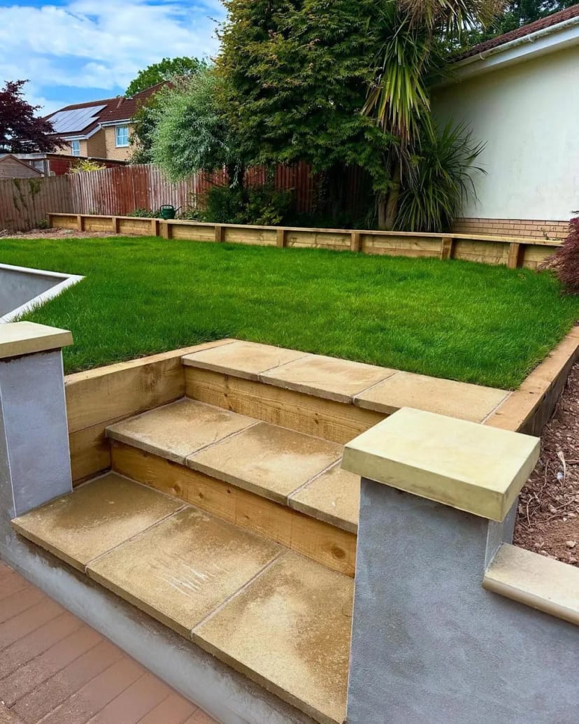 Full garden renovation - levelling, sleeper beds, fresh turf, porcelain copings and new steps