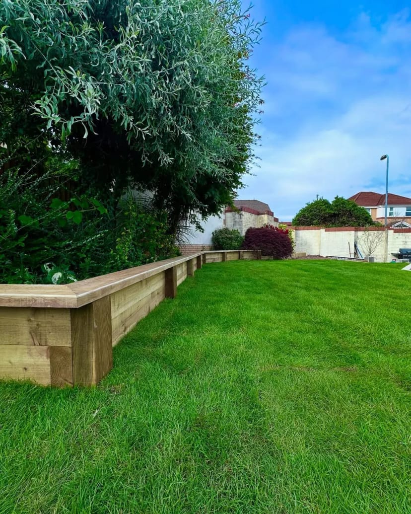 Full garden renovation - levelling, sleeper beds, fresh turf, porcelain copings and new steps