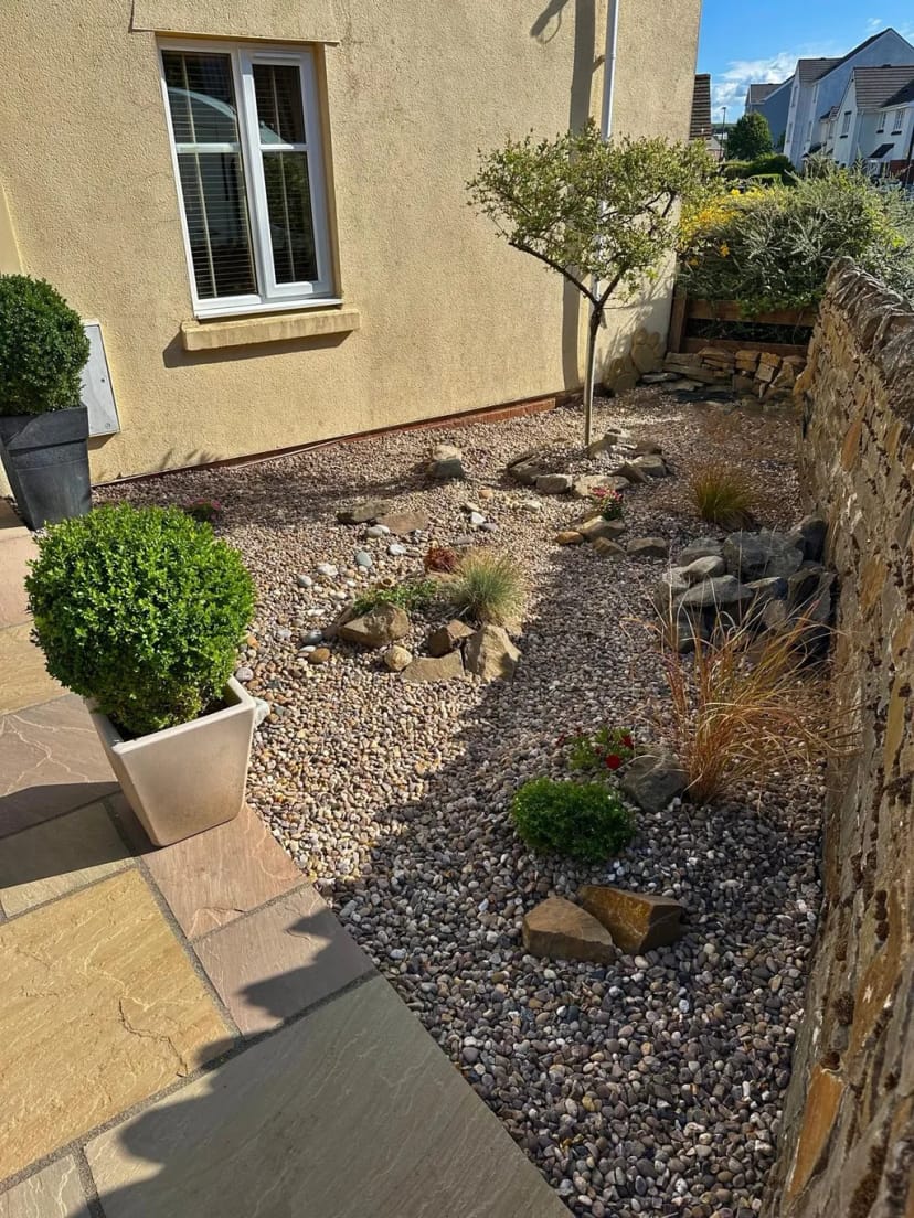 Rockery garden with sandstone paving